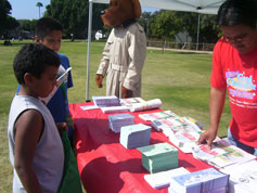 Community Safety Expo staff handing out safety information
